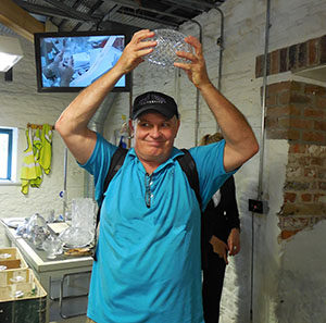 Jim DuFresne holds up the BCS College Football trophy.